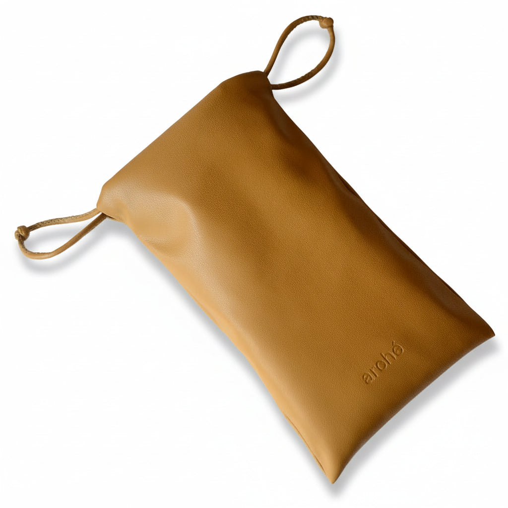 Brown leather pouch with a drawstring on a white background